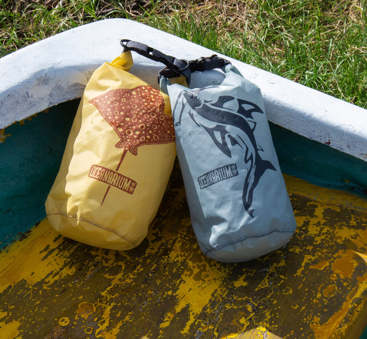 Ocean-print dry bags on a boat
